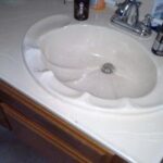 shot of a old bathroom sink and counter