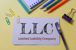LLC Limited Liability Company text writing in a piece of paper