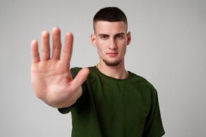 man in stop gesture