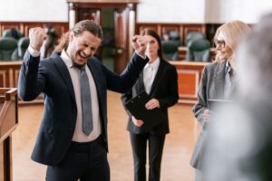 Man showing win gesture in Court