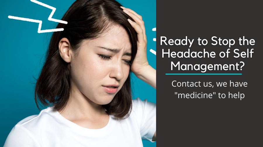 I grimacing woman holding her head