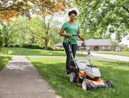 woman mowing